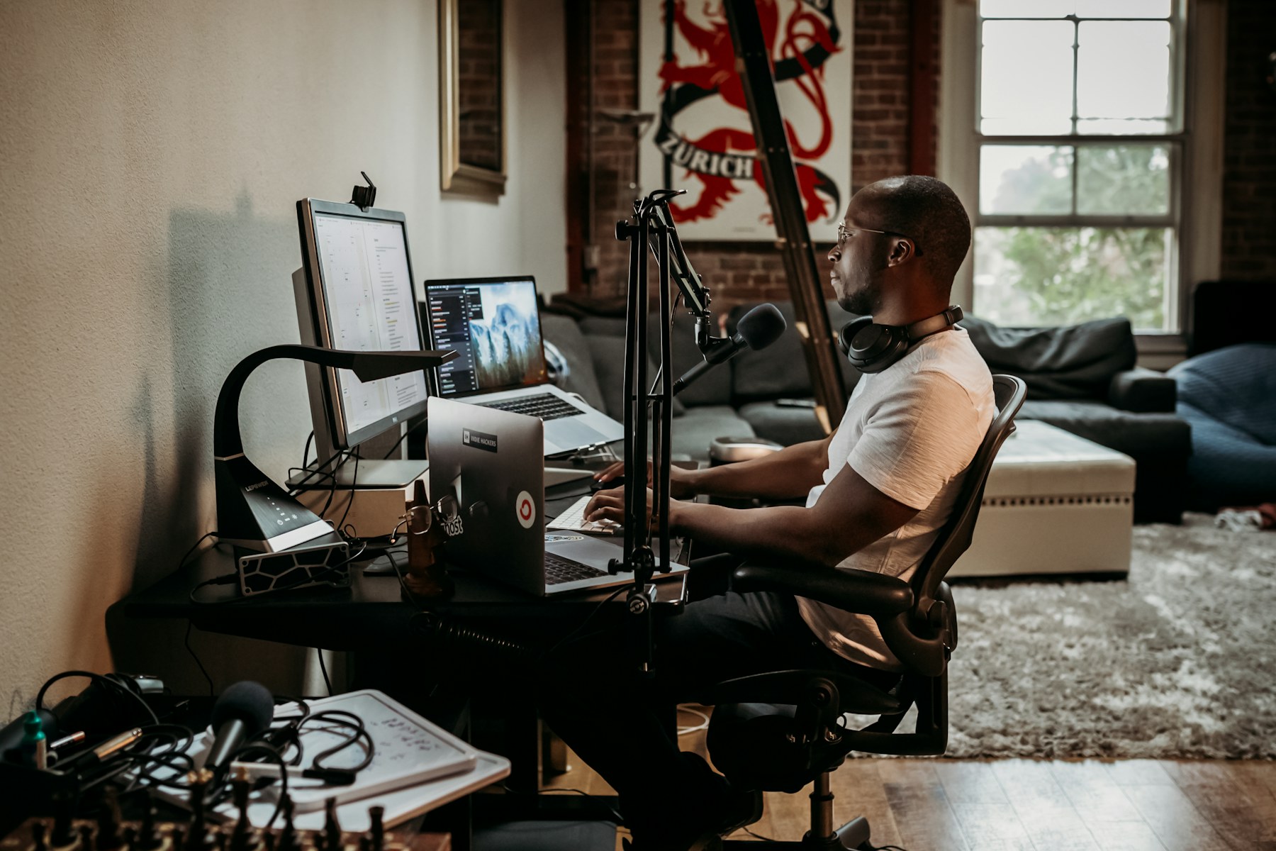 A subscription creator managing content from a home workspace